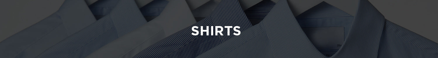 Men's purple dress shirt on slice of walnut tree.